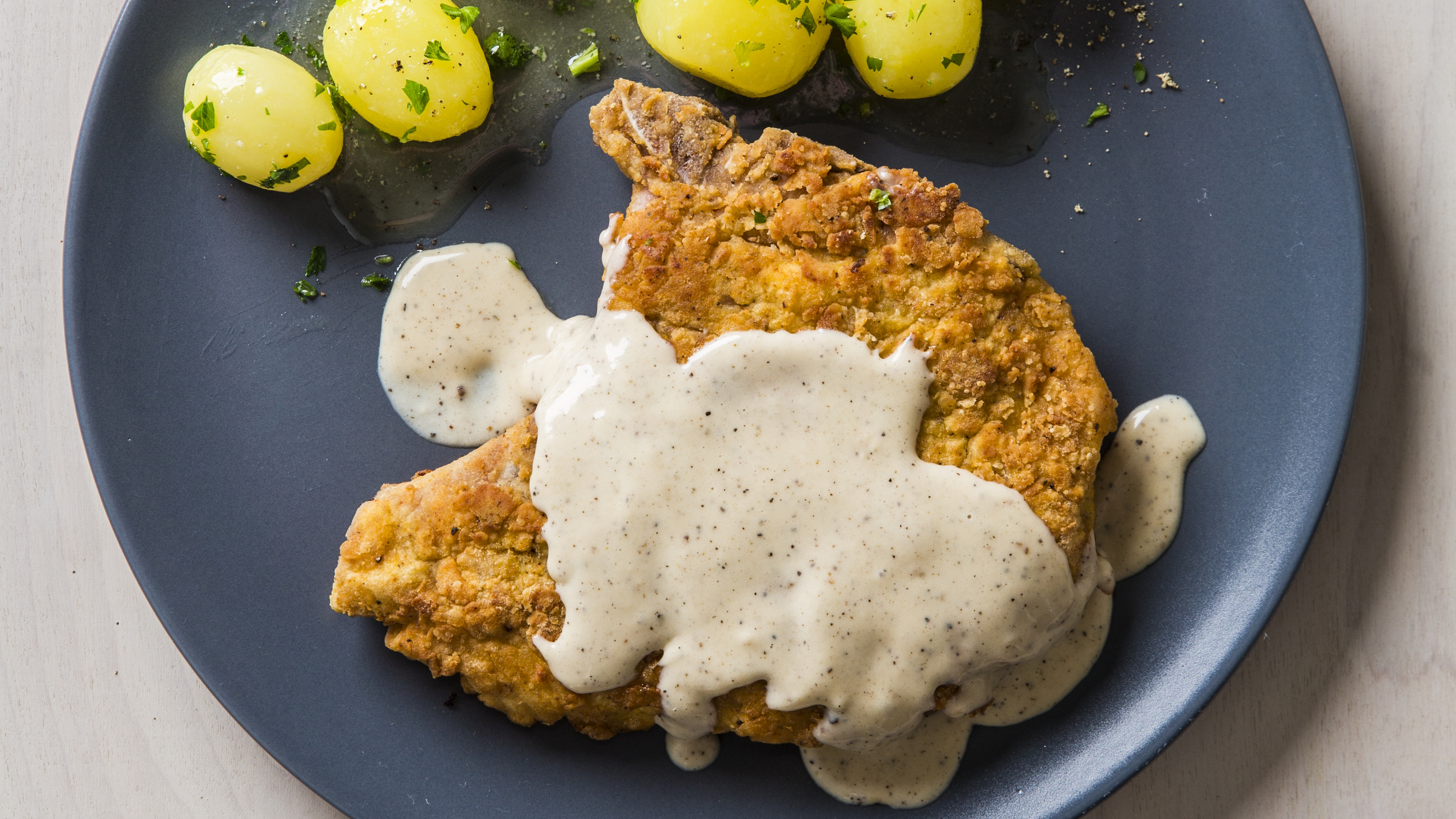 Pan fried pork chop with milk gravy